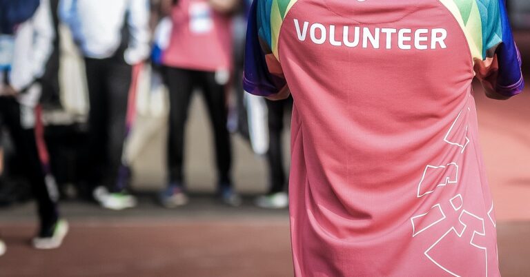 Close up of the back of a shirt that says Volunteer