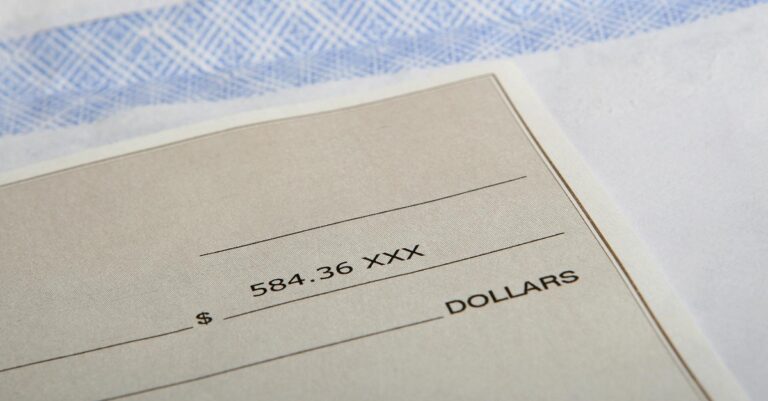 close up of a $584.36 cheque representing uncashed CRA cheques