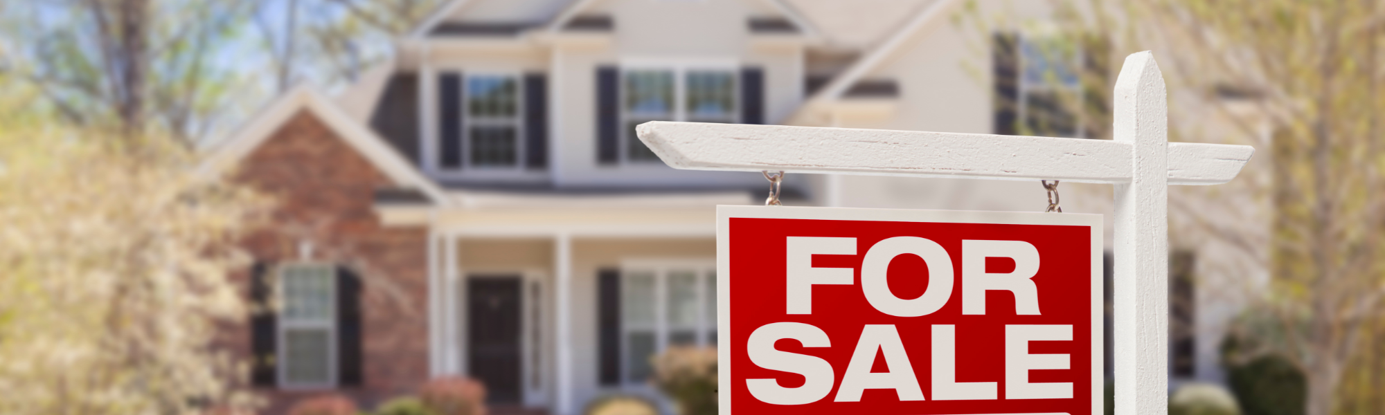 A house with a for sale sign