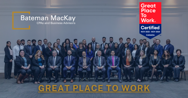 Great Place to work announcement photo with a group of professionally dressed people and logos