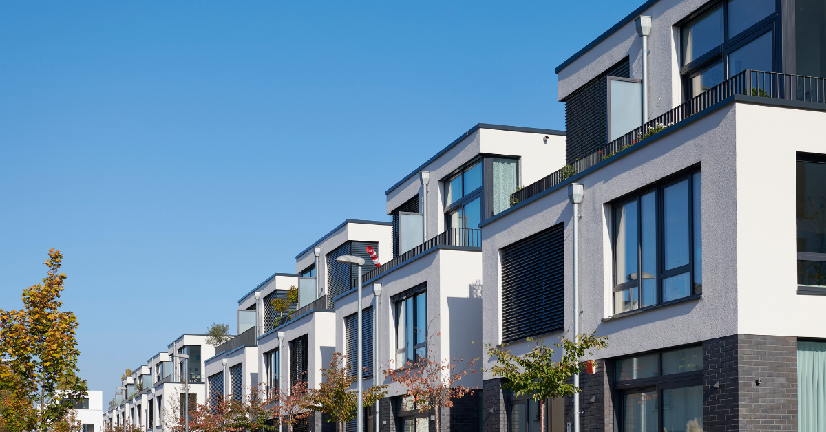 row of town houses under a blue sky